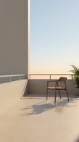 Modern minimalist rooftop terrace with wooden chair, metal railing, and potted plant overlooking serene sunset sky. Ideal for contemporary interior design, real estate, and lifestyle projects.