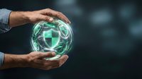 Businessman hands protecting glowing digital shield sphere with cybersecurity icons for data protection and network safety concepts.