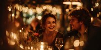 Young couple enjoying romantic dinner date in restaurant with warm ambient lighting and bokeh effect. Intimate atmosphere for special occasions.
