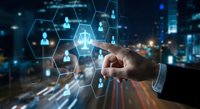 Businessman touching digital network interface with user icons and connections over blurred city lights background for technology and communication concepts.
