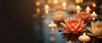 Floating lotus flowers and candles create serene spa atmosphere with warm bokeh lights reflecting on water surface for meditation and wellness.
