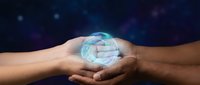 Two hands holding glowing digital sphere with holographic data visualization against dark blue starry background, representing technology, innovation, and future connectivity.