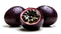 Fresh passion fruits with water drops on dark purple skin, one cut in half showing black seeds and white membrane against white background, macro food photography.
