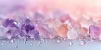 Sparkling amethyst and rose quartz crystal fragments with water droplets creating magical bokeh light effects on soft gradient background for wellness designs.