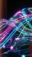 Neon glowing fiber optic cables with vibrant pink, cyan, and lime green light streams flowing across dark background, representing digital connectivity and data transmission technology.