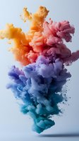 Vibrant orange, pink, purple and blue ink clouds swirling in water against light background, creating dynamic abstract fluid art composition with smooth color transitions.