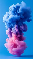 Vibrant pink and blue smoke clouds swirling against bright blue background creating dramatic abstract art effect, suitable for modern design projects and creative backgrounds.