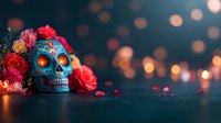 Decorative blue sugar skull with red roses and orange bokeh lights on dark background. Traditional Mexican Day of Dead celebration symbol with floral details.