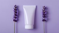 White cosmetic tube mockup between fresh lavender flowers on purple background, minimal beauty product presentation for skincare and spa designs.