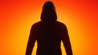 Mysterious hooded figure silhouette against vibrant orange and red gradient background, dramatic backlit dark shadow creating ominous atmosphere.