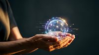 Human hands holding glowing digital sphere with network connections representing global technology, artificial intelligence and data visualization concepts.