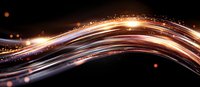 Abstract glowing wave with golden light trails and sparkles against dark background, flowing dynamic energy lines creating modern futuristic effect.