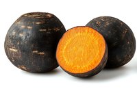 Fresh black radish root vegetables with vibrant orange flesh cross-section showing nutritious interior on white background isolated for culinary design.