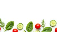 Fresh vegetables border with spinach leaves, cucumber slices, cherry tomatoes and dill herbs on white background for healthy cooking and nutrition.