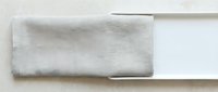 Folded beige linen fabric swatch on white background, isolated textile sample for interior design, upholstery, and home decor projects.