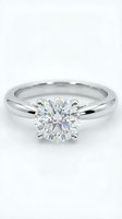 Elegant solitaire diamond engagement ring with brilliant cut stone in white gold setting isolated on white background for jewelry design.