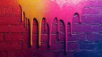 Vibrant paint drips cascade down textured brick wall in gradient colors from orange to pink to purple, creating dramatic urban art effect against rough surface.