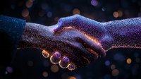 Glowing digital handshake made of luminous particles against dark background symbolizes business agreement, partnership and technological connection.