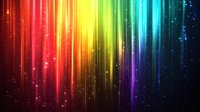 Vibrant rainbow spectrum with glowing light streaks and sparkles falling against dark background creates magical atmospheric effect. Suitable for abstract designs.