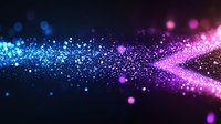 Magical glowing particles flow from blue to pink creating dynamic motion effect against dark background, abstract light bokeh design for festive backgrounds.