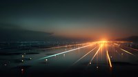 Airport runway at night with bright landing lights creating dramatic light trails against dark sky for aviation and travel concepts.