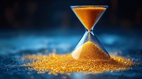 Elegant hourglass with golden sand against blue background symbolizing time management and business deadlines.