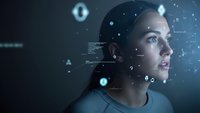 Young woman interacting with futuristic holographic interface displaying digital data and virtual reality elements in dark technological environment.