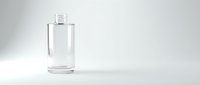 Clear glass bottle with pump dispenser on white background for cosmetic packaging and skincare product design.