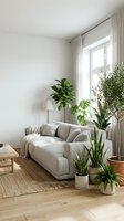 Scandinavian living room interior with light gray upholstered sofa, potted green plants, wooden floor, natural window light, and minimalist decor for home design and interior styling projects.