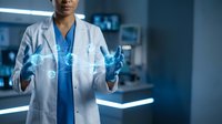 Female doctor in white coat holding glowing digital brain hologram in modern medical laboratory for neuroscience research and healthcare technology applications.