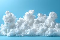 Fluffy white cumulus clouds against bright blue sky background, dramatic cloudscape with soft cotton-like texture creating natural atmospheric scenery.