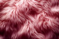 Luxurious pink faux fur texture with soft, flowing strands creating dynamic light and shadow patterns. Seamless background for fashion, textile and interior design projects.