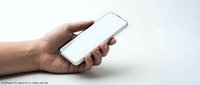 Hand holding white smartphone with blank screen isolated on white background for mobile app mockup and digital technology presentation.