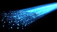 Glowing blue optical fiber strands with scattered light particles against dark background, modern technology and data transmission concept.