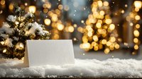 Blank greeting card in snow with small Christmas tree and golden bokeh lights background, festive winter holiday scene.