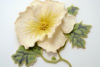 Decorative cream-colored flower wall art with detailed petals and green leaves, crafted in relief style against white background. Suitable for interior design.