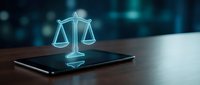 Digital scales of justice hologram glowing on smartphone screen, representing legal technology, law firm services, and digital compliance solutions.