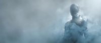 Man silhouette dissolving into clouds and mist, representing transformation, freedom, and ethereal concepts for creative and editorial projects.