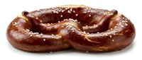 Freshly baked pretzel with coarse salt crystals on golden-brown twisted dough, isolated on white background for bakery, food, and culinary design projects.