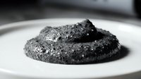 Stacked dark cookies with sugar coating on white plate, monochrome food photography for bakery, dessert, and culinary design projects.