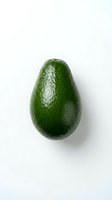 Fresh whole avocado with textured green skin isolated on white background. Suitable for food, nutrition, healthy eating, recipe, and culinary design projects.
