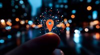 Glowing orange location pin marker with digital network connections floating above finger against blurred city lights and bokeh background at night.