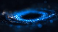 Magical blue glowing particles swirling in dark space creating luminous spiral trail with bokeh light effect and blurred motion on black background.