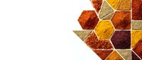 Colorful spices arranged in hexagonal containers creating geometric pattern on white background for culinary and cooking designs.