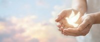 Hands holding glowing light against sky background, symbolizing hope, spirituality, and positive energy for wellness and inspirational concepts.