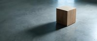Wooden cube on concrete floor with dramatic shadow, suitable for minimalist design, interior concepts, and architectural visualization projects.