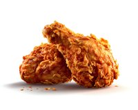 Crispy golden fried chicken pieces with crunchy breading and flaky coating on white background, isolated food photography for restaurant menu and advertising.