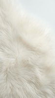 Luxurious white fur texture with soft fluffy fibers creating natural patterns for cozy interior design and fashion projects.
