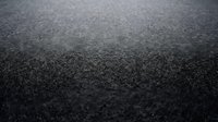 Fresh black asphalt road surface texture with fine grain detail for construction and transportation backgrounds.