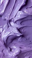 Swirling lavender cosmetic cream texture with glossy surface and flowing ripples creates abstract background pattern for beauty product advertising.